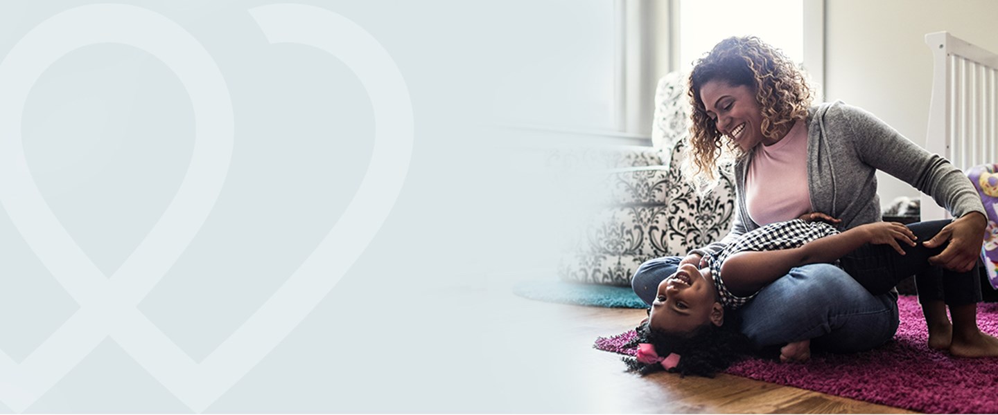 A woman playing with her daughter